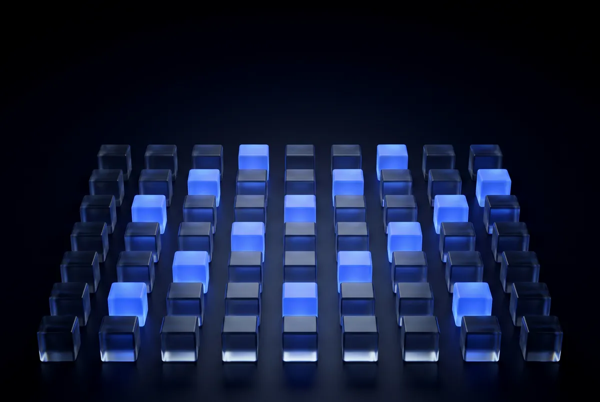 A grid of glass cubes with some of them lit in blue