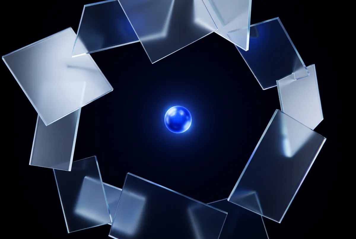 A glowing blue orb reflected in a ring of glass panels